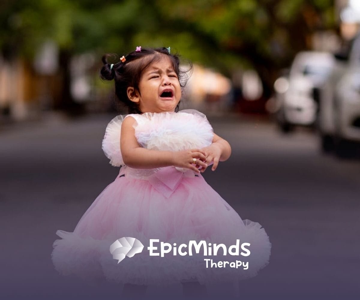 A little autistic girl in a pink frilly dress having a meltdown outdoors on a street in North Carolina.
