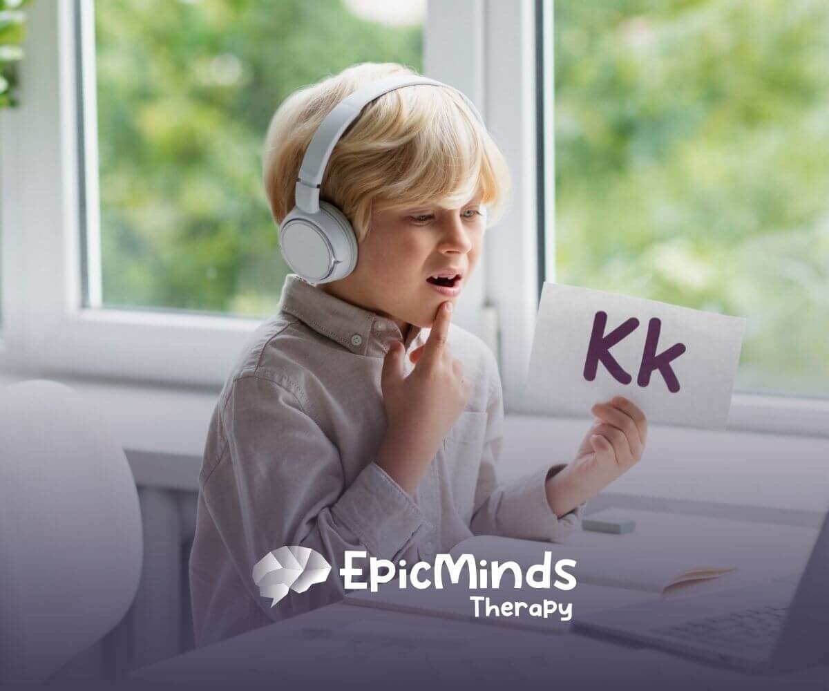Boy with autism using flashcards and headphones while practicing speech online.