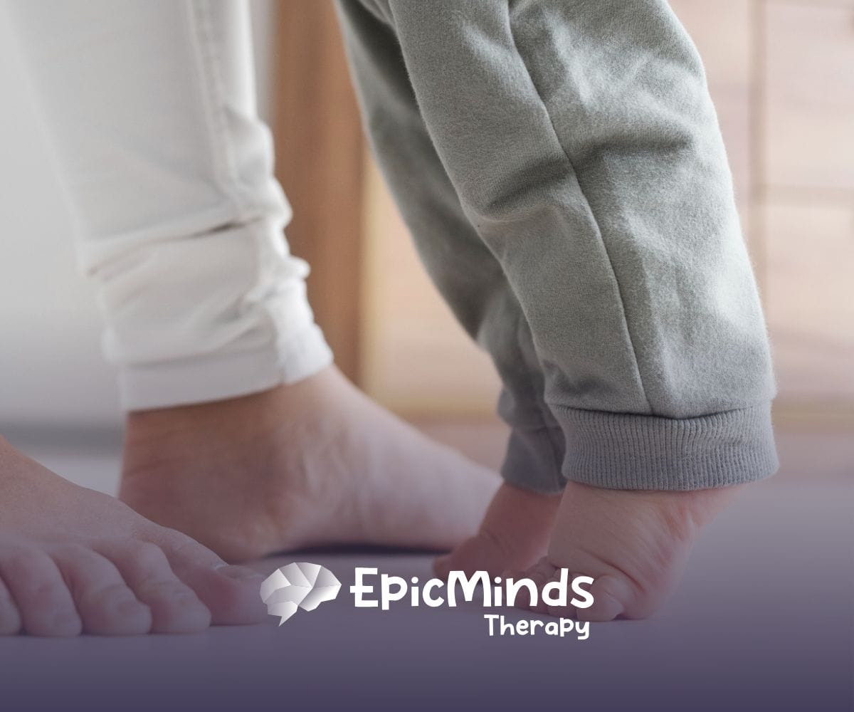 A mom assisting her child who is toe walking